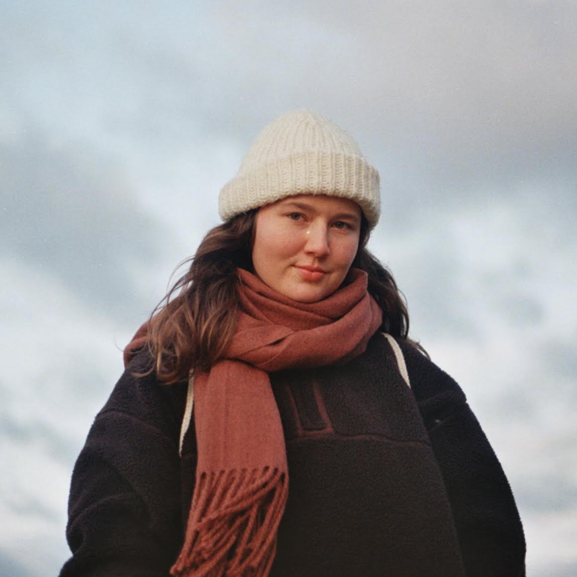 Olivia Hird in a brown fleece on an overcast day.